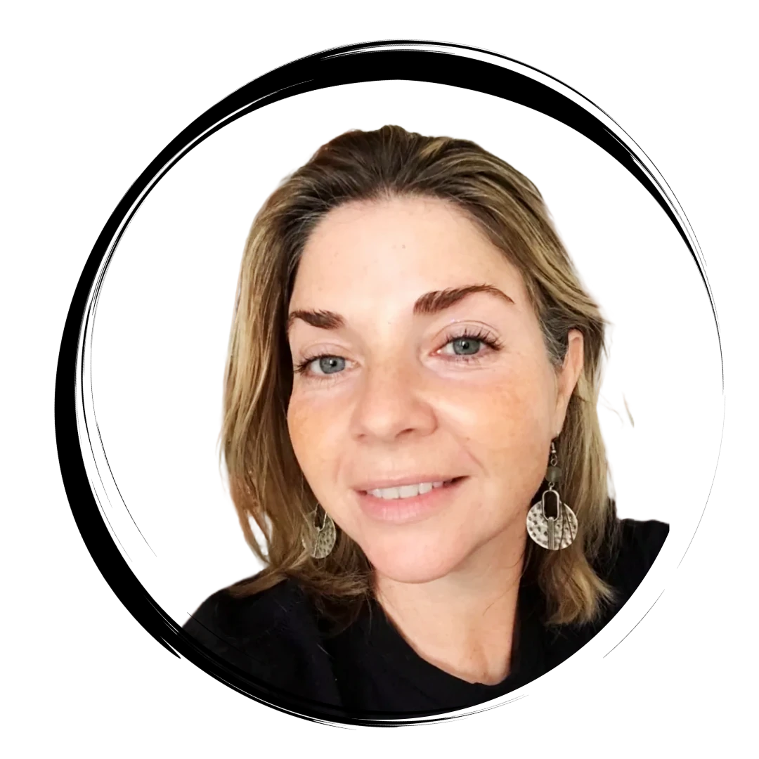 Jamie Cicatiello smiling, wearing silver earrings